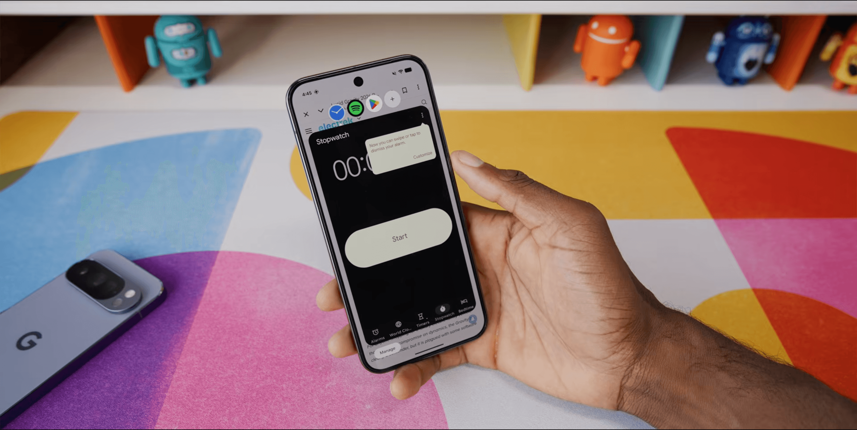 Android 17 bubble bar with multiple app bubbles above a stopwatch on Pixel