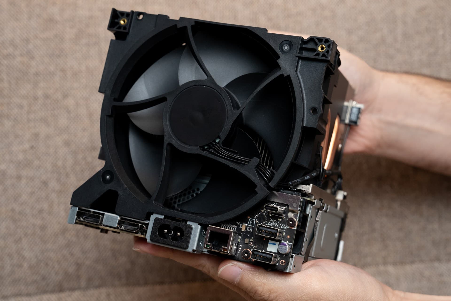 Steam Machine internal cooling fan assembly with heat pipes and rear I/O ports exposed