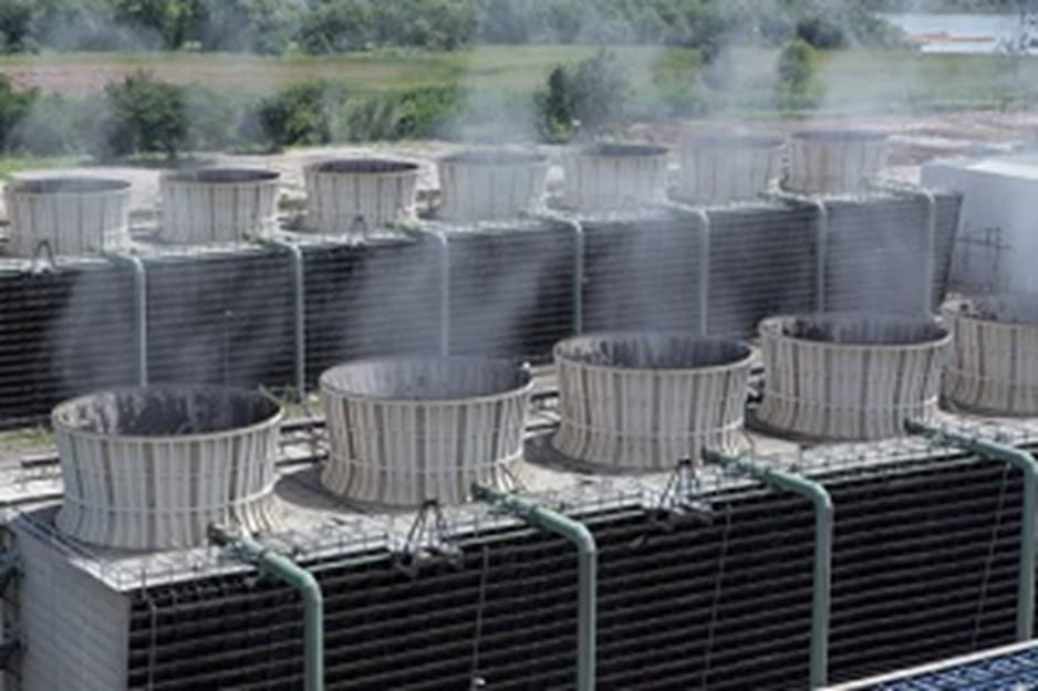Evaporative cooling towers at a data center that consume freshwater to keep AI servers cool